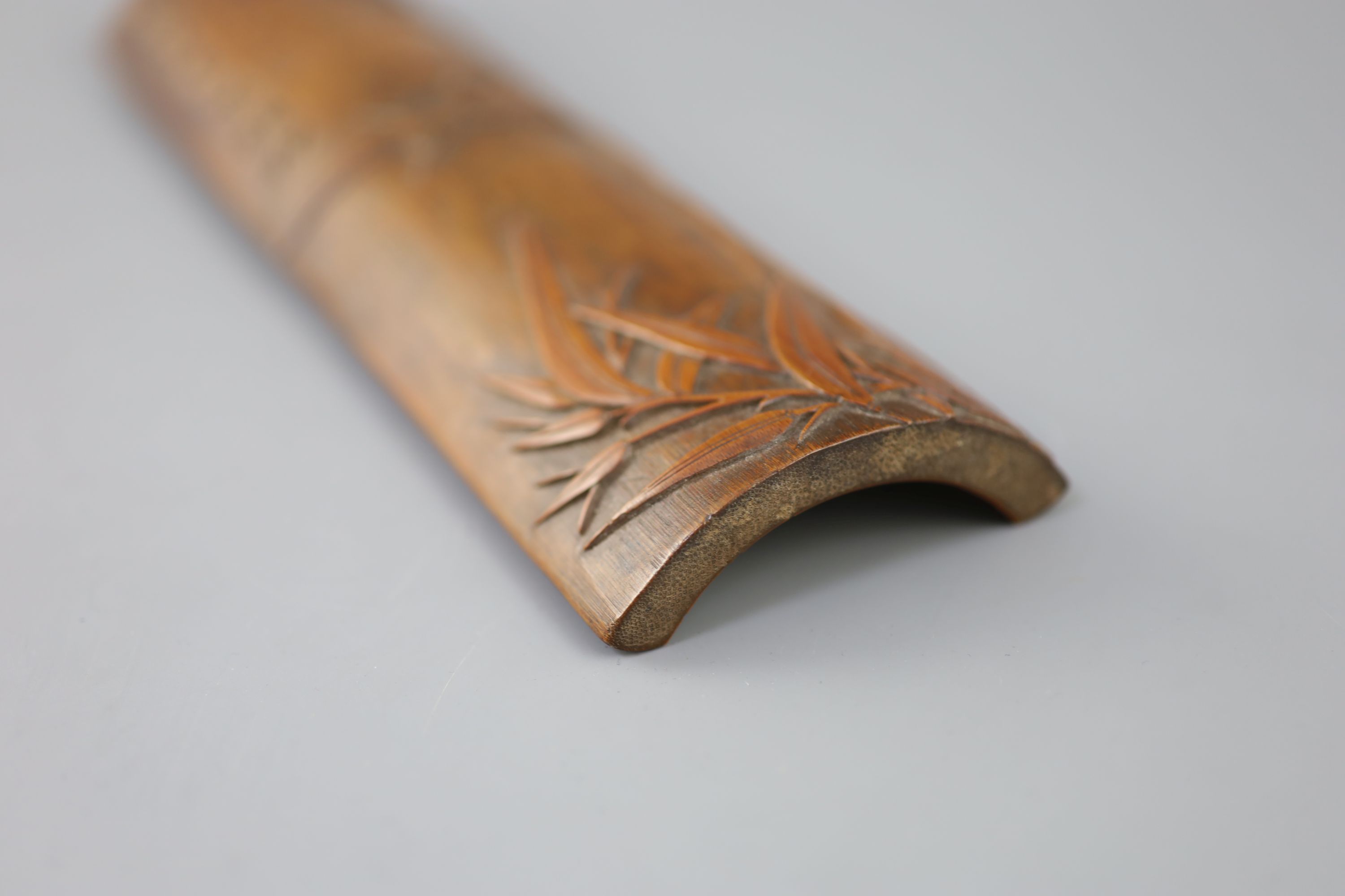 A Chinese bamboo bamboo sprig wrist rest, 18th century,